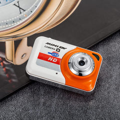 Ultra mini digital camera X6 keychain with high-definition lens in grey design.