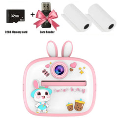 Kids instant print digital camera with rabbit design, 32GB memory, card reader, and thermal paper rolls.