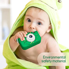 Cute baby with a green kids' digital camera made of environmental safety material.