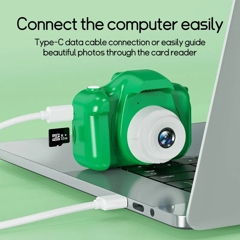 Kids' digital camera connected to a laptop using a Type-C cable, 32G card inserted.