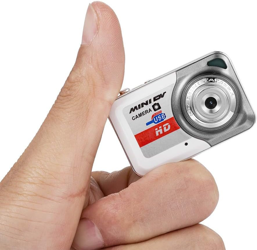 Digital Camera X6 ultra mini keychain camera in hand, showcasing compact design and HD functionality.