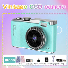 Vintage style green 4K 64MP digital camera with accessories including decal, card reader, and sling.